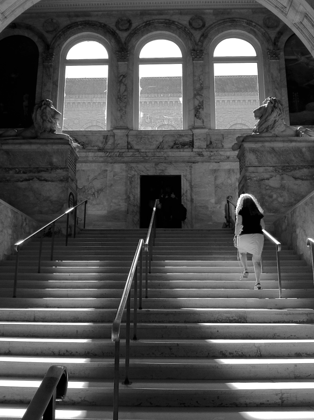 Walking up the main staircase at the Boston Public Library