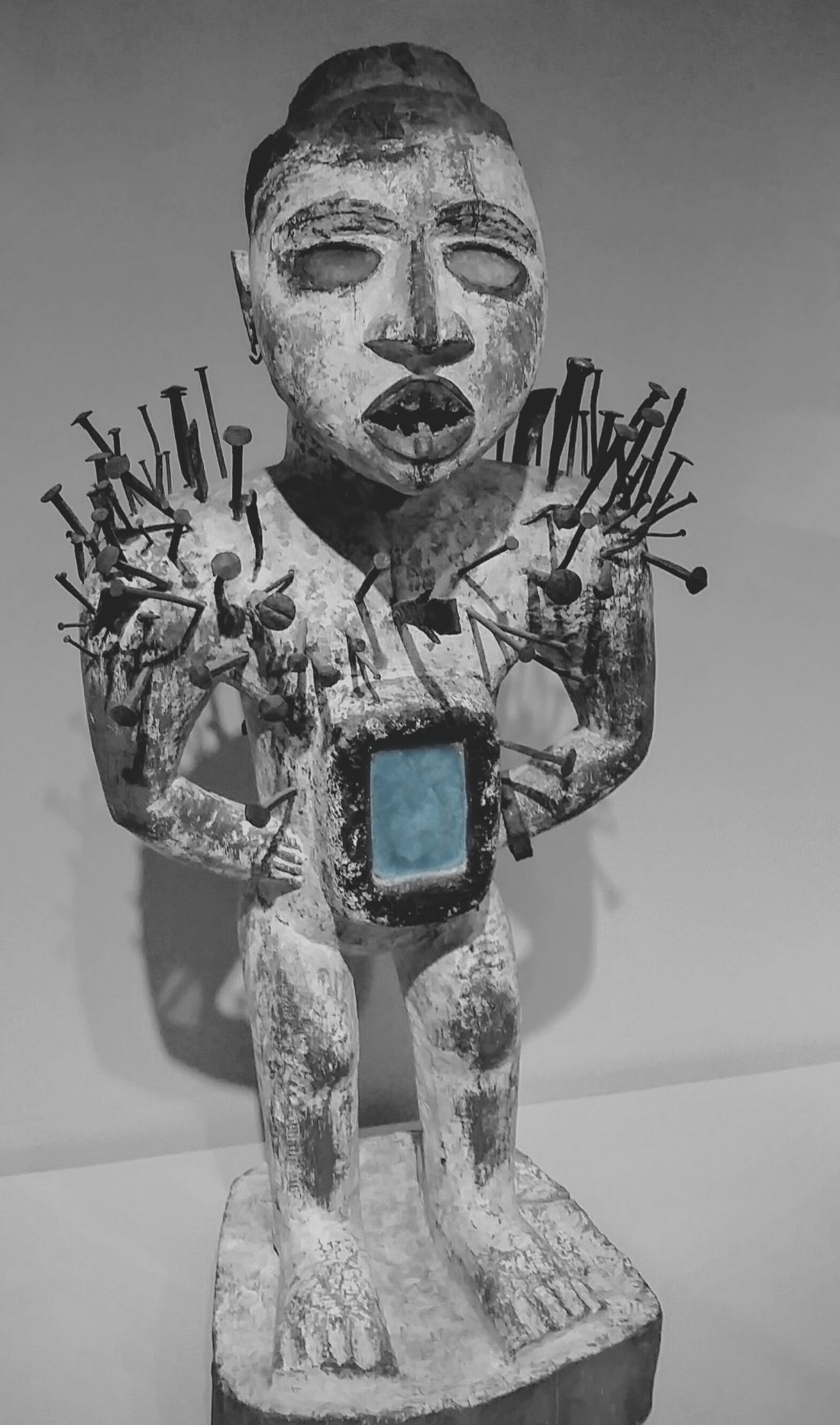 African Power Figure with Blue Accent.